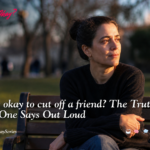 A person sitting alone reflecting on the decision “is it okay to cut off a friend,” showing emotional conflict and quiet relief